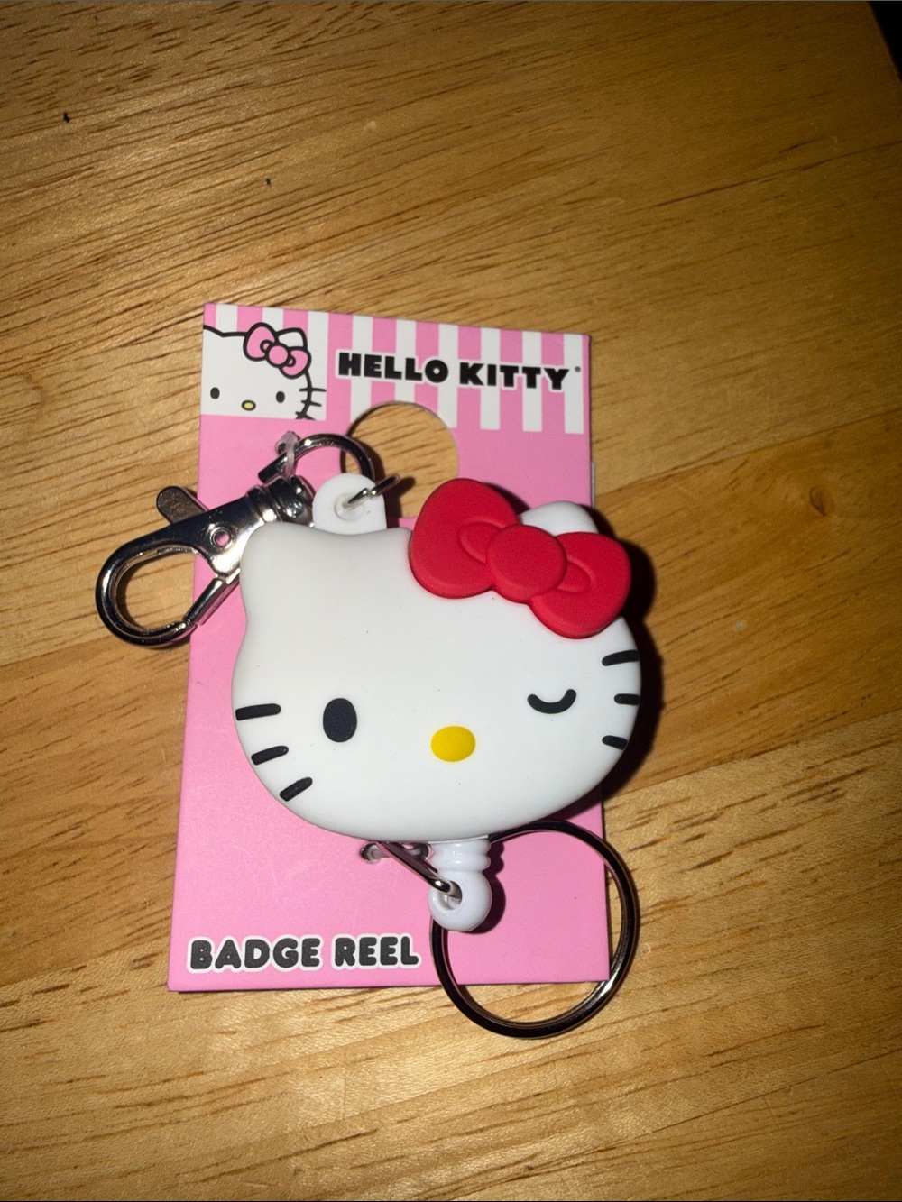 Hello Kitty White and Red Winking Badge Reel Keychain